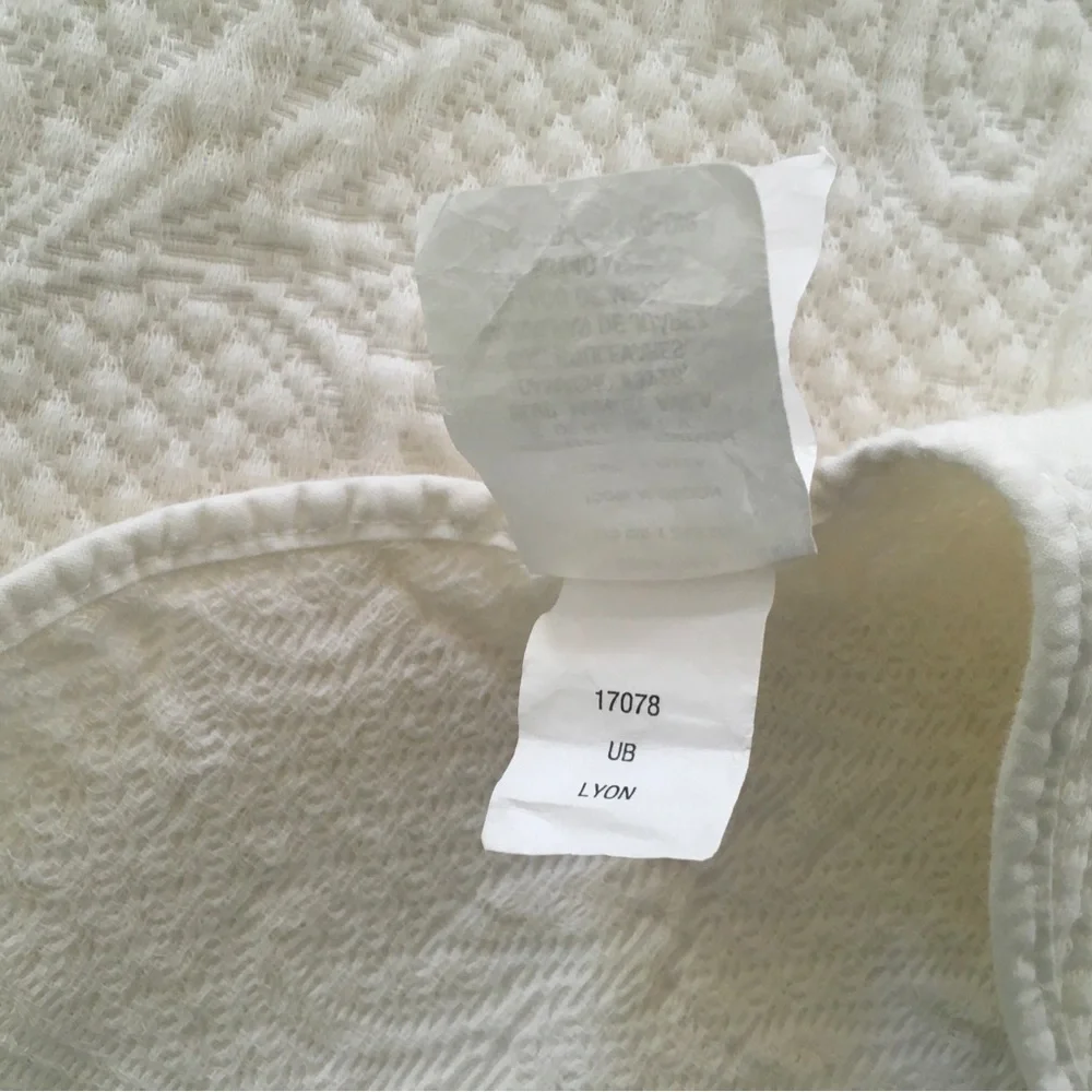 white matelassé coverlet